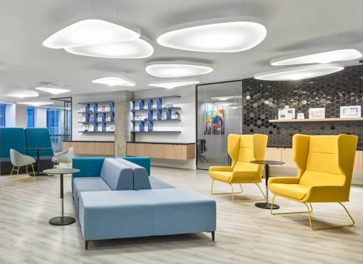 Lounge with yellow wingback chairs and a blue sofa at The 365 Bay Centre (2018 photo)