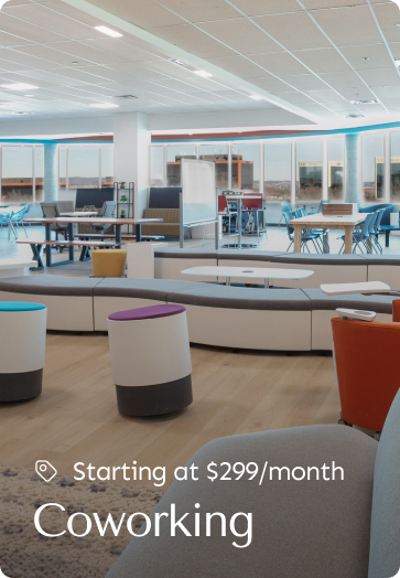 Open coworking space with modern furniture and collaborative seating, starting at $299/month.