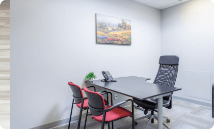 Modern office with chairs and desk in a bright environment