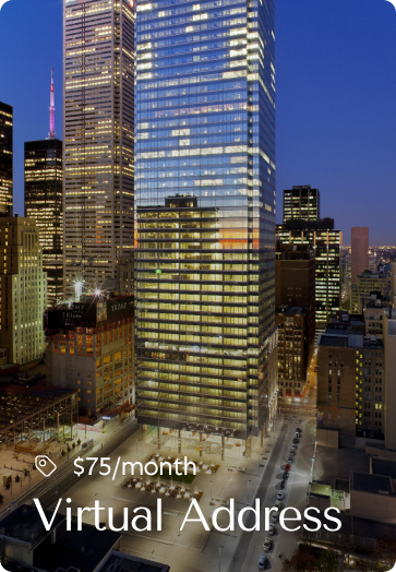 High-rise office building in a city skyline at night, representing virtual address services for $75/month.